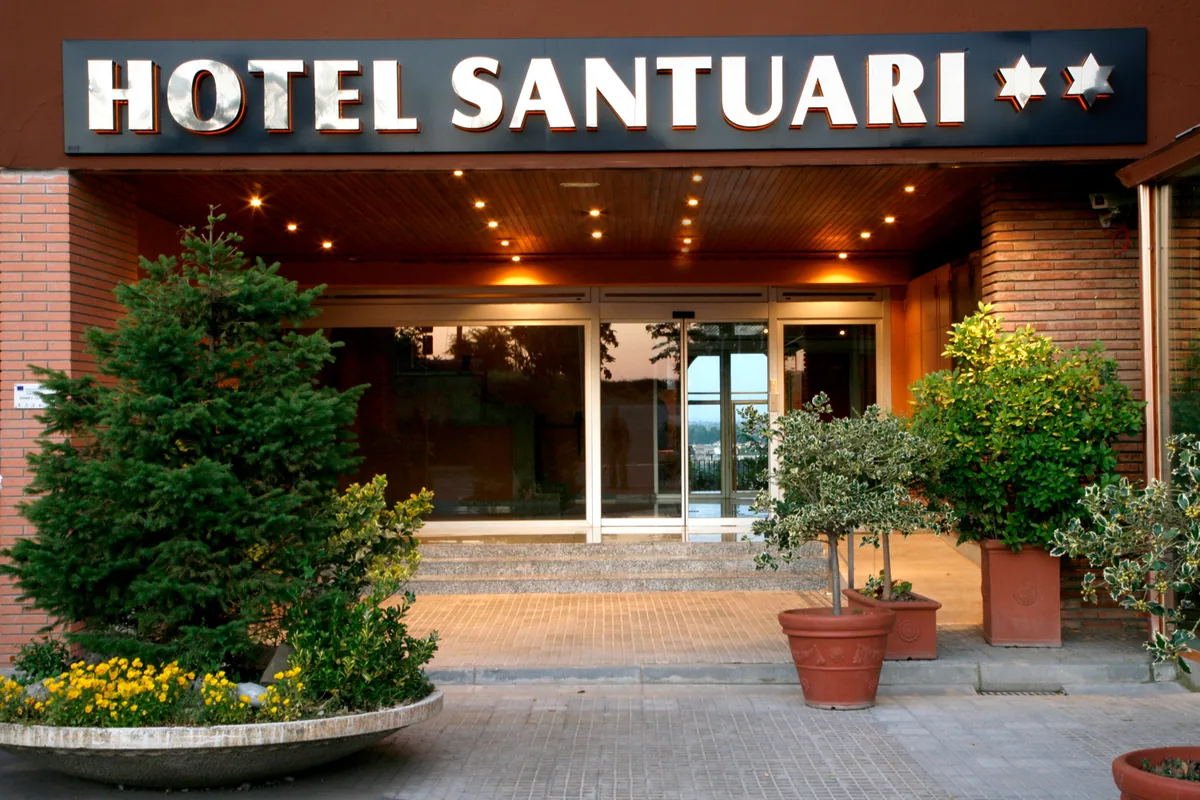 The entrance to Hotel Santuari, with parking on site